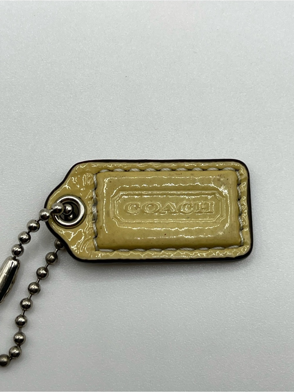 Coach Patent Leather Hang Tag in Yellow